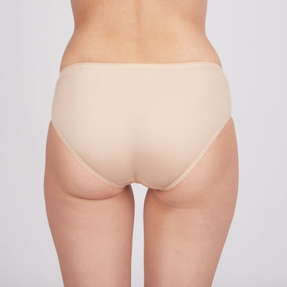 Beige women's bikini-style underwear viewed from the back against a plain light background.
