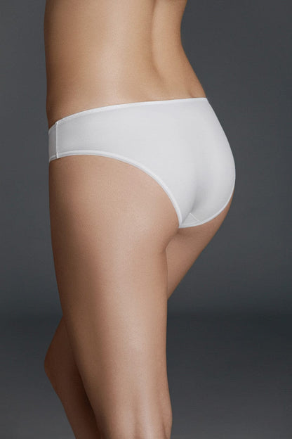 A pair of plain white bikini-style underwear viewed from the back on a person against a neutral grey background.