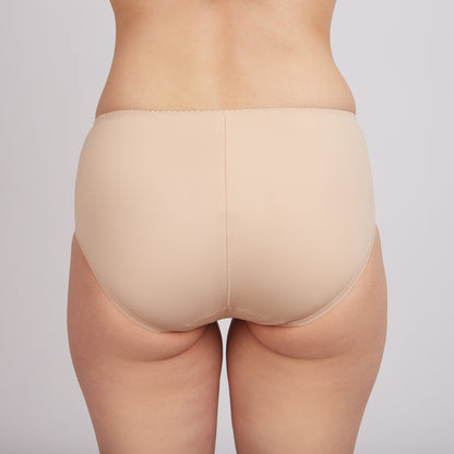 A back view of a pair of beige, full-coverage briefs worn on a person against a neutral background.