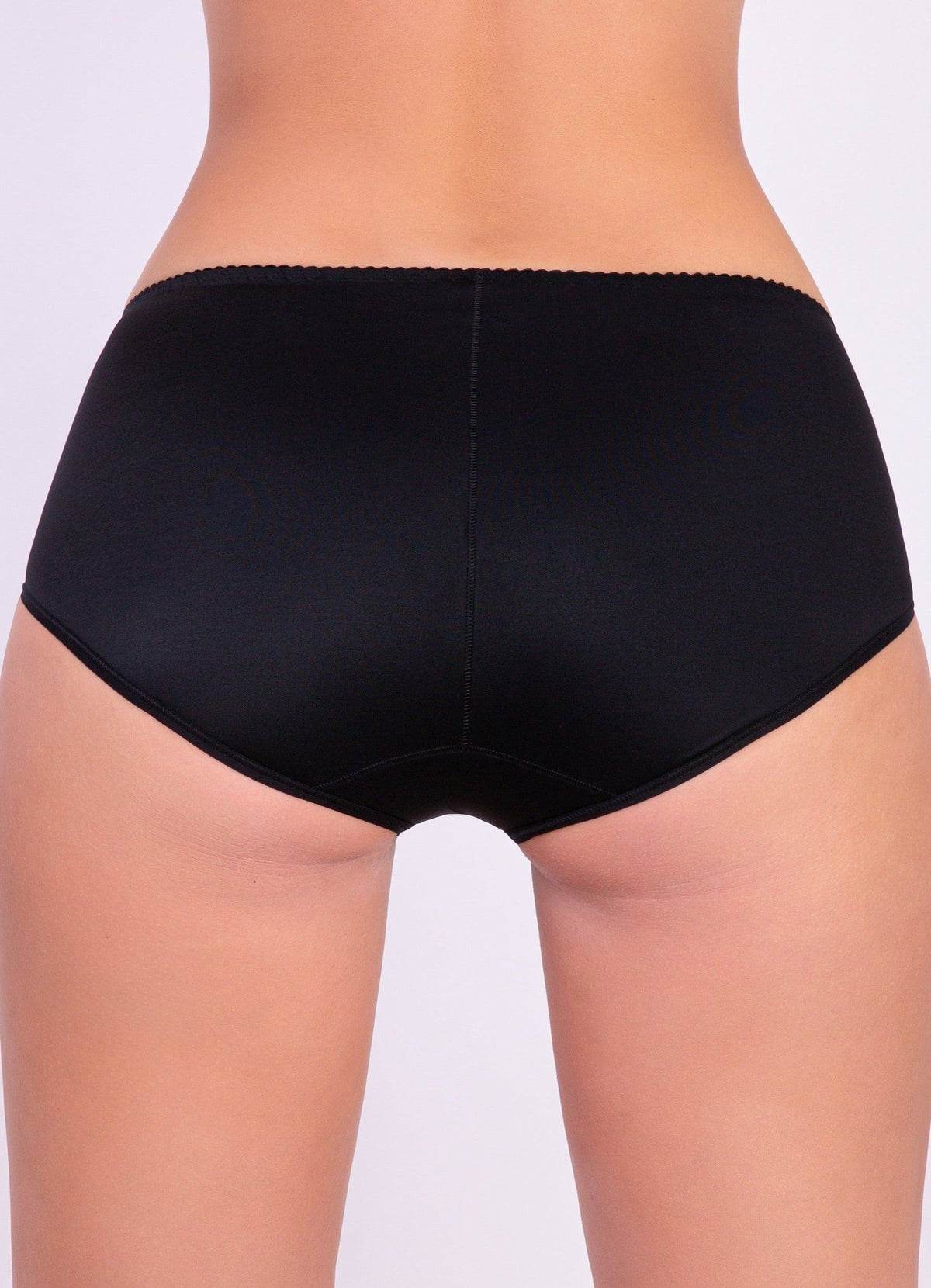 Black full-coverage panties with a seamless construction worn on a person.