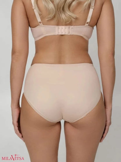 Beige high-waisted briefs seen from the back on a person wearing a matching bra.