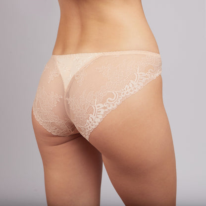 Beige lace cheeky-cut underwear worn from the back view against a plain grey background.