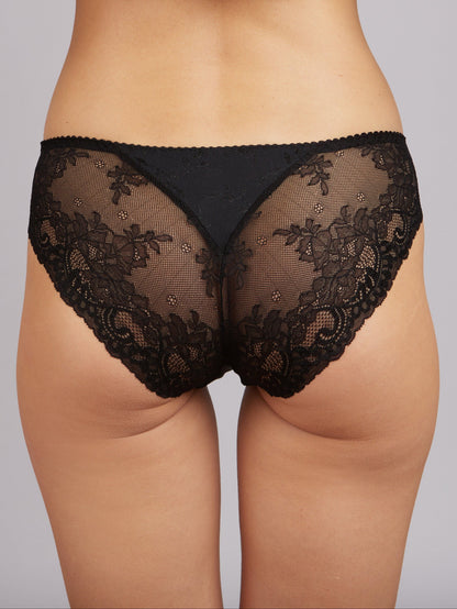 Black lace panties with a solid black panel on the back against a plain light gray background.