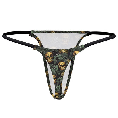 A thong with a black waistband featuring an all-over print of skulls nestled inside pineapple tops against a dark background.