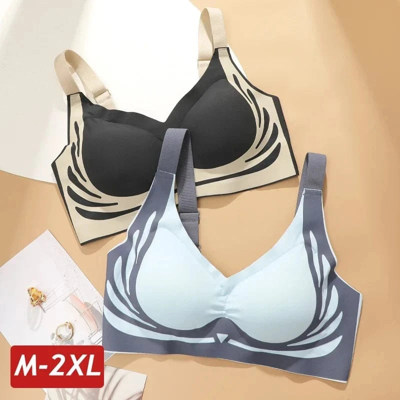 Two seamless sports bras with decorative wing-like patterns on the sides, one in black and beige and the other in light blue and dark gray, displayed on a neutral background.