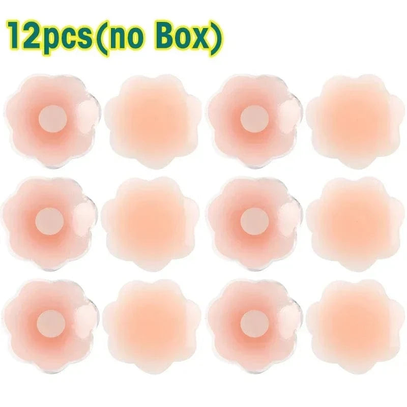 Twelve flower-shaped, skin-toned silicone nipple covers are arranged in a four-by-three grid on a white background, with text at the top indicating there is no box included.