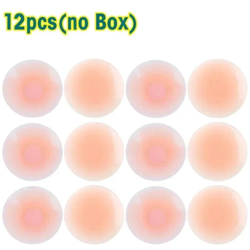 Twelve circular, skin-toned adhesive nipple covers arranged in a three-by-four grid against a white background.