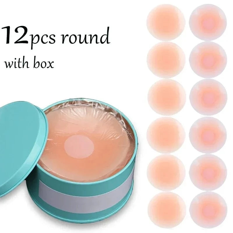 Twelve round skin-toned adhesive nipple covers are displayed next to a circular teal storage tin containing the covers.