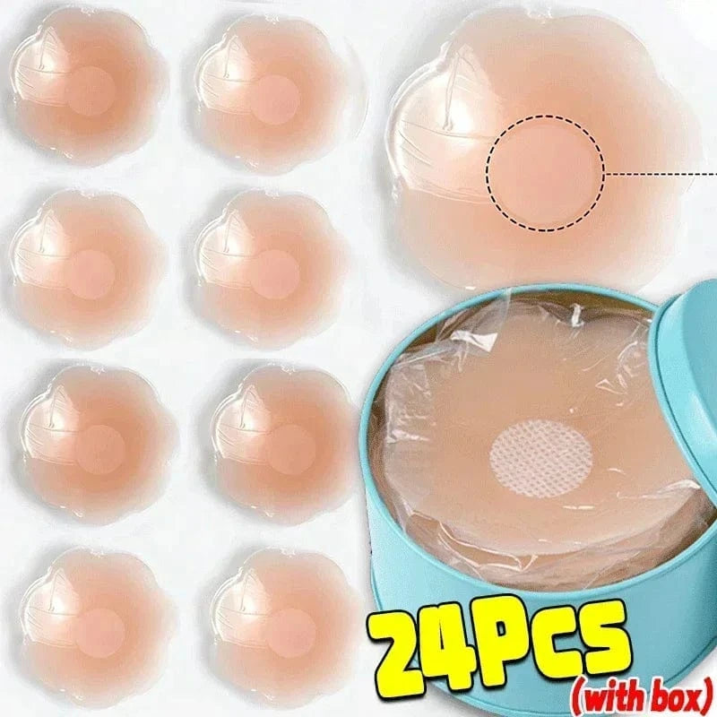 A set of twenty-four adhesive silicone nipple covers in a light skin tone with a flower petal shape, displayed next to a round blue storage tin containing several units.