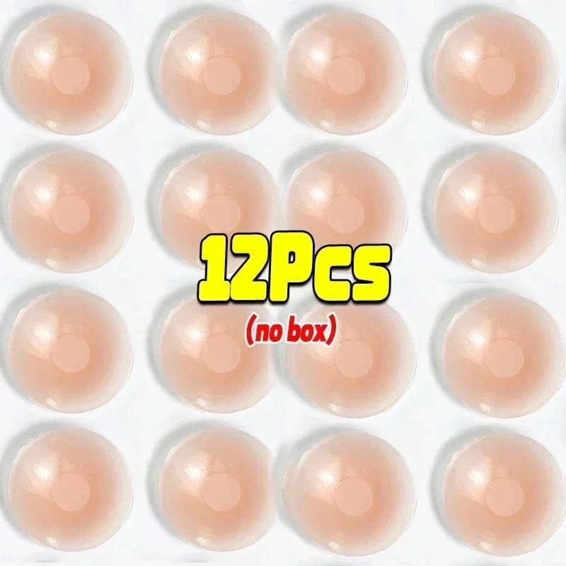 Twelve round, skin-toned adhesive nipple covers are arranged in a four-by-three grid against a plain white background.