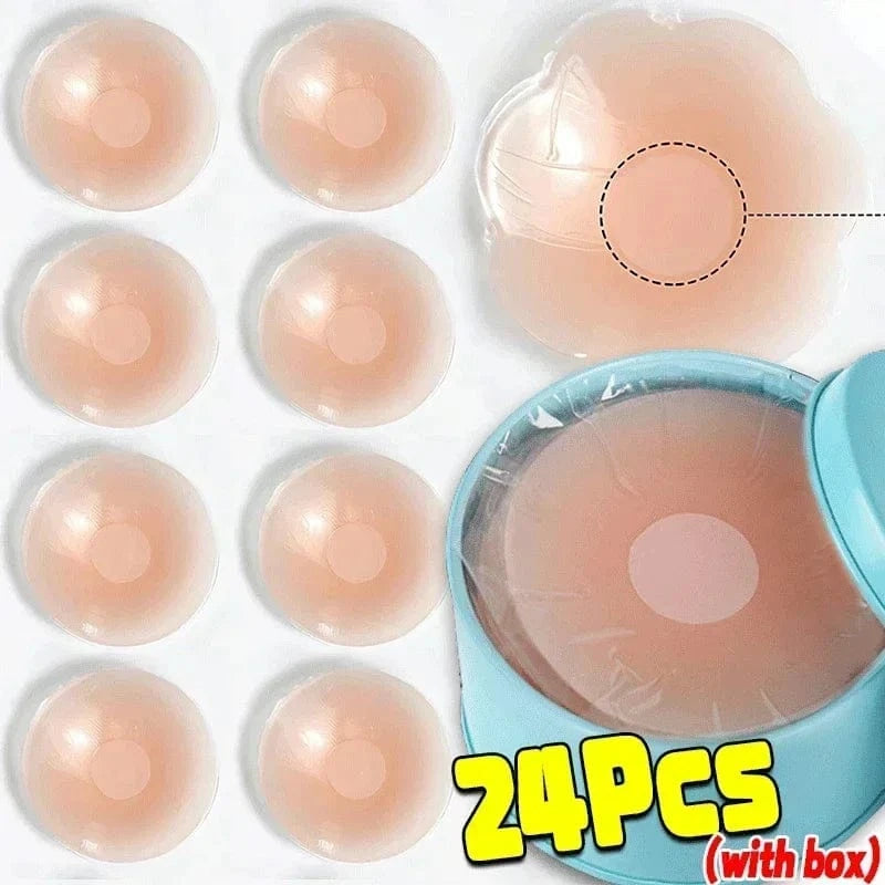 Multiple round, light-beige nipple covers are shown arranged in rows next to a blue storage container filled with the covers, with a single flower-shaped cover highlighted on the right.