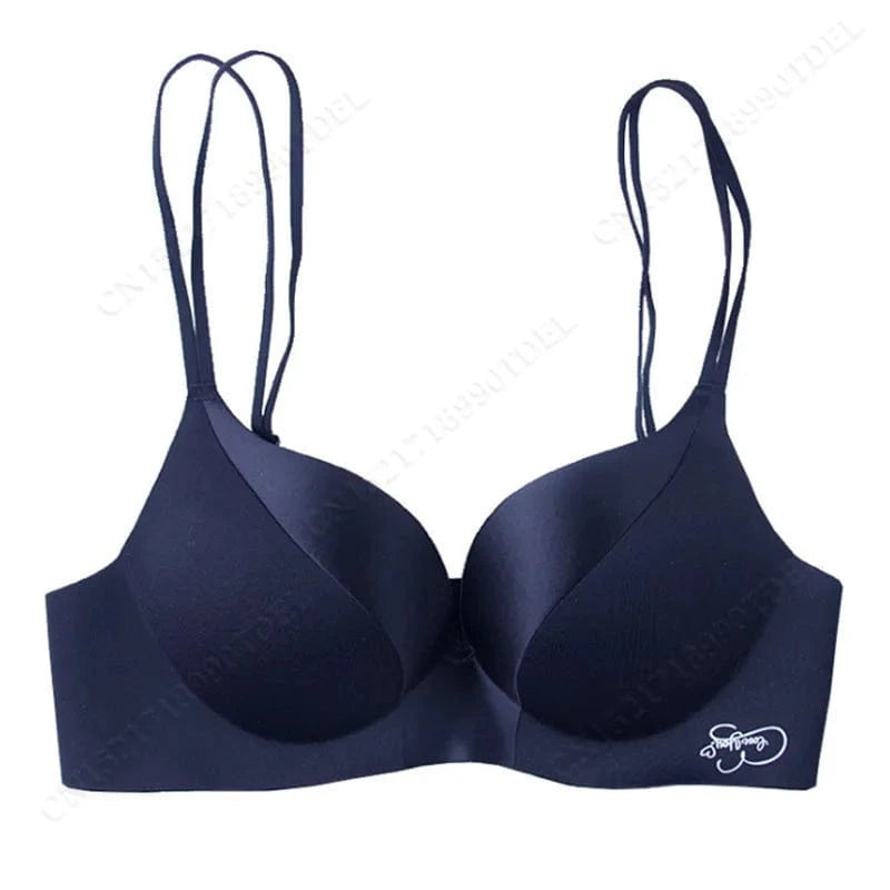 A navy blue seamless push-up bra with double straps and a small white embroidered logo on the bottom right side.