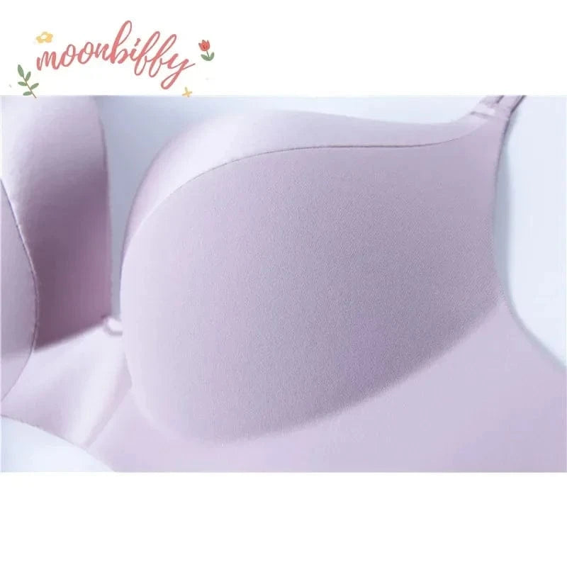 A light purple, smooth-textured, padded bra featuring a deep plunge neckline.