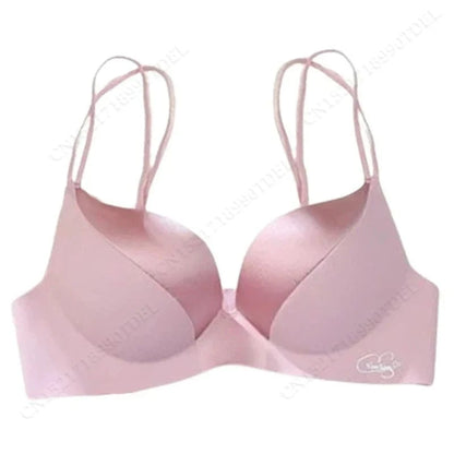 A light pink padded brassiere with thin, double-strap shoulder straps and a smooth, seamless finish against a white background.