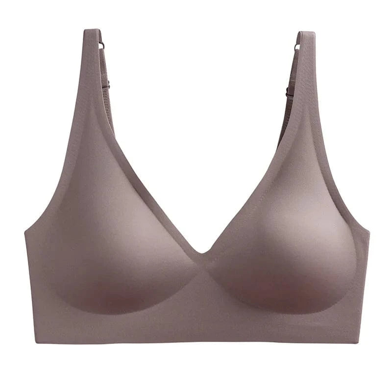 A mocha-colored, seamless, wireless bra with a deep V-neckline and adjustable shoulder straps against a plain white background.