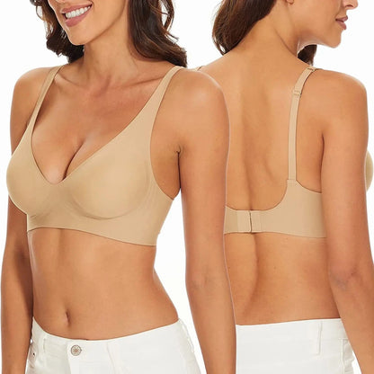 A beige wireless bra shown from both the front and back view on a person wearing white bottoms.