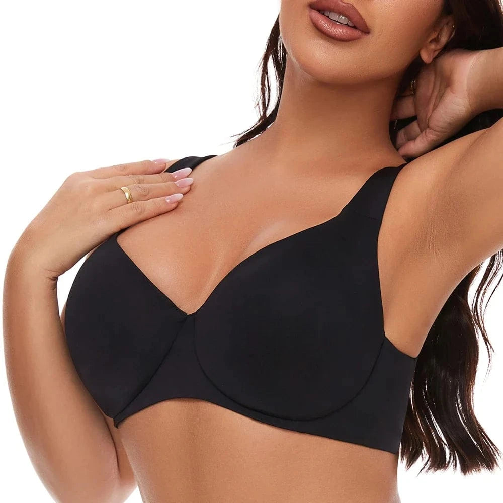 A black seamless bra worn by a model with a sweetheart neckline and wide shoulder straps.