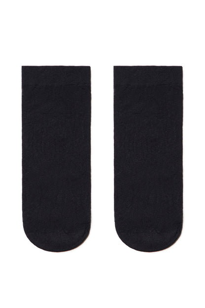 A pair of sheer black ankle socks laid flat against a white background.