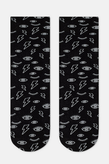 A pair of black socks featuring an all-over print of silver lightning bolts and eyes with long eyelashes.