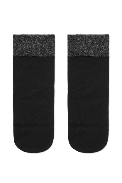 A pair of black ankle socks featuring a textured, shimmering silver metallic band at the top.