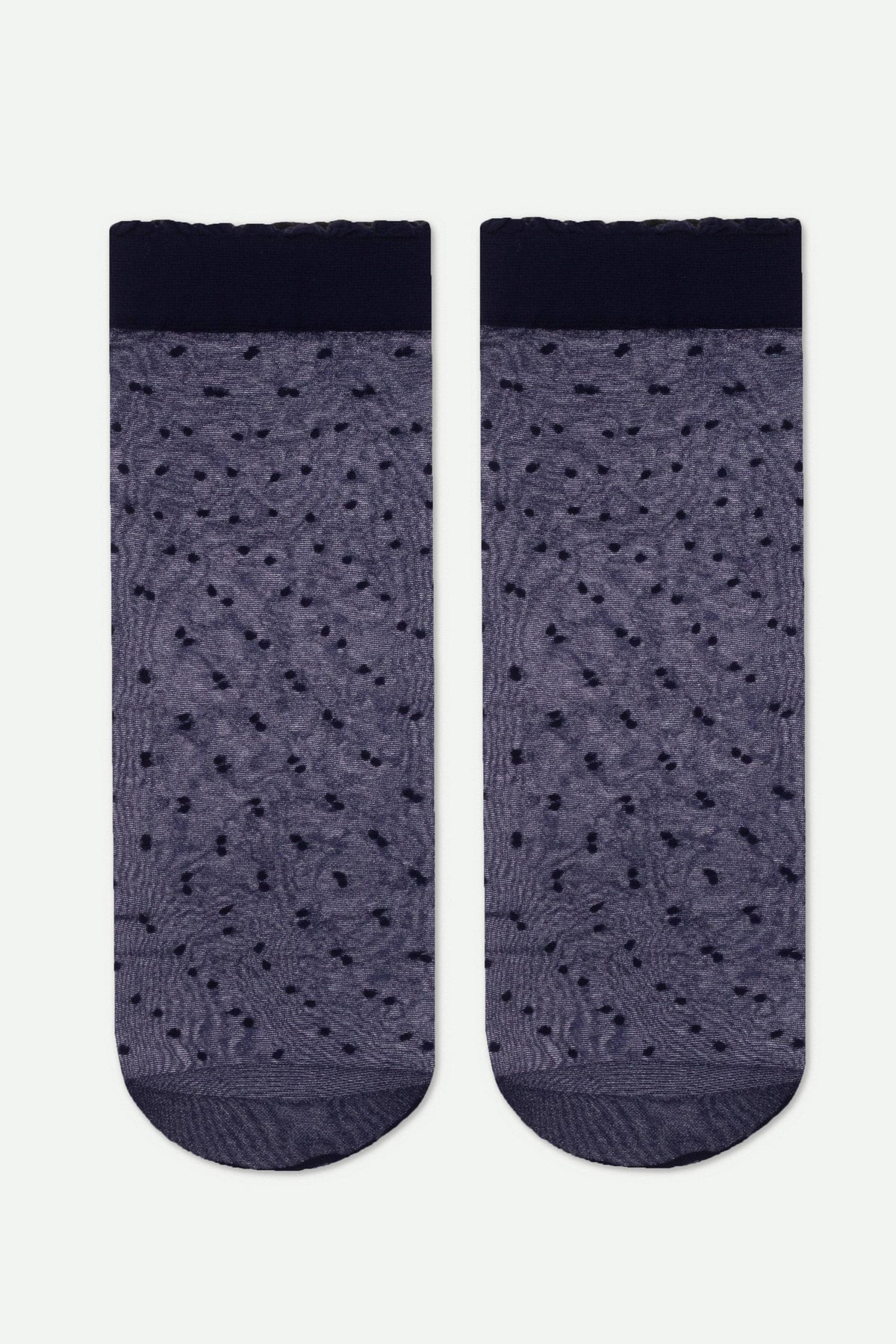 A pair of sheer, navy blue ankle socks featuring a textured dotted pattern and a solid dark cuff with a ruffled edge.