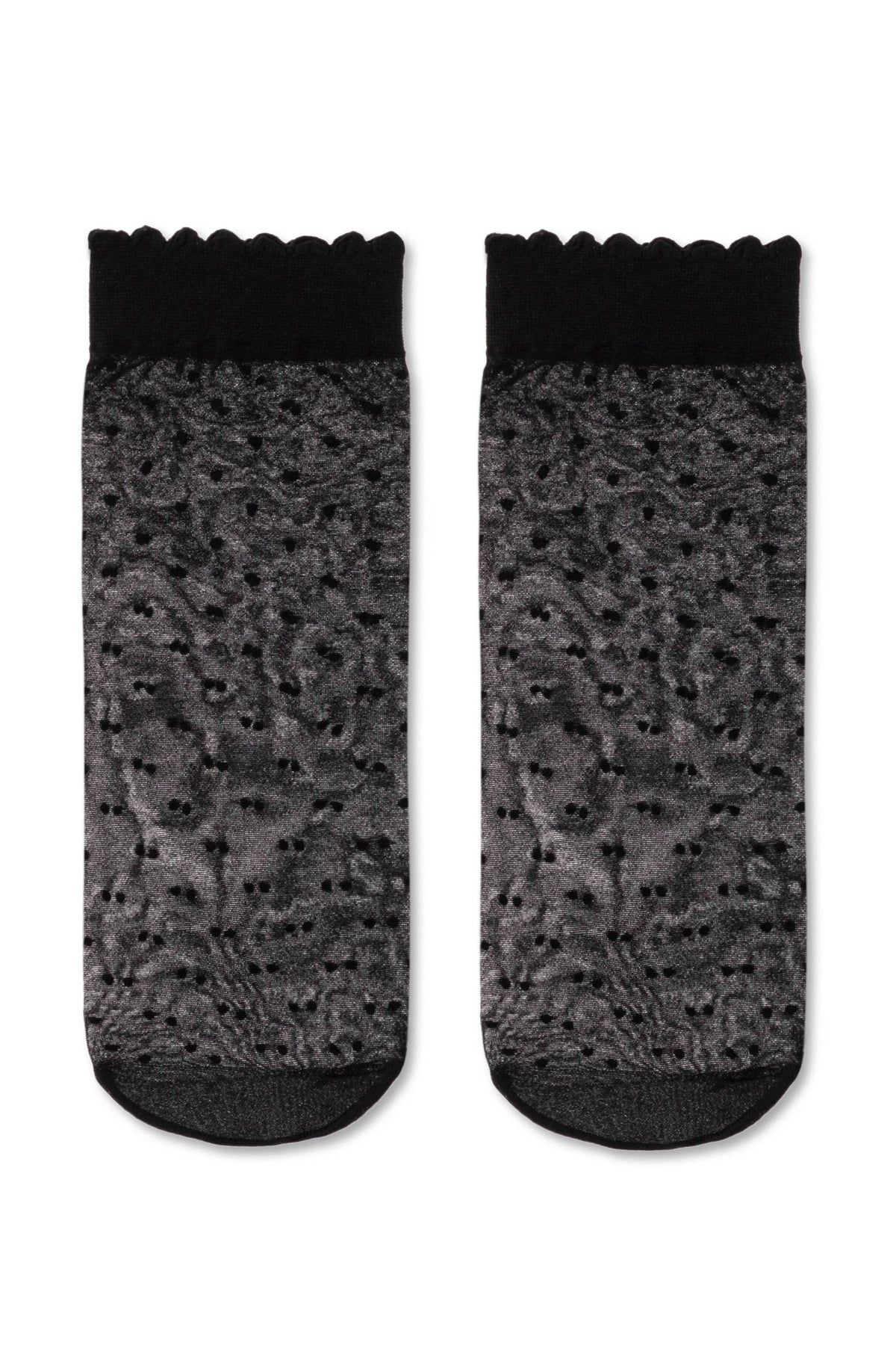 A pair of sheer black ankle socks with a shimmering grey textured pattern and a scalloped black cuff.