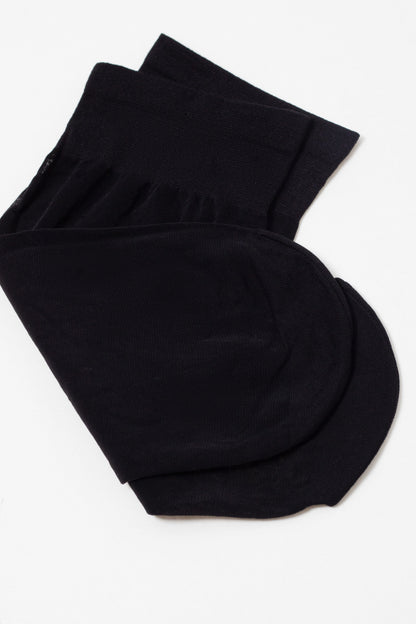 A pair of solid black ankle socks layered neatly against a plain white background.