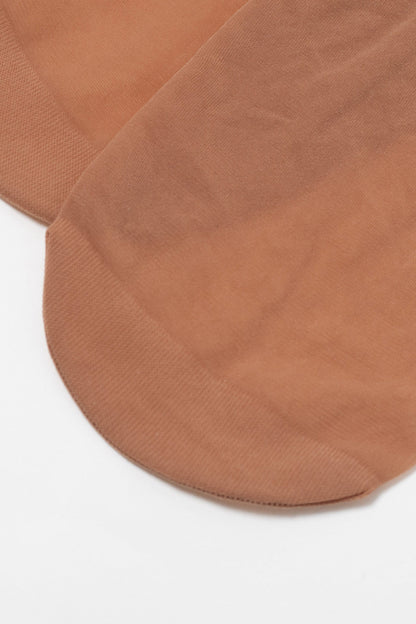 A pair of sheer tan-colored ankle socks laid flat on a white background.