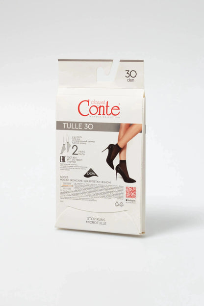 A box of black, sheer, ankle-high stockings for women shown in a product shot with a cut-out preview of the hosiery worn with high-heeled shoes.