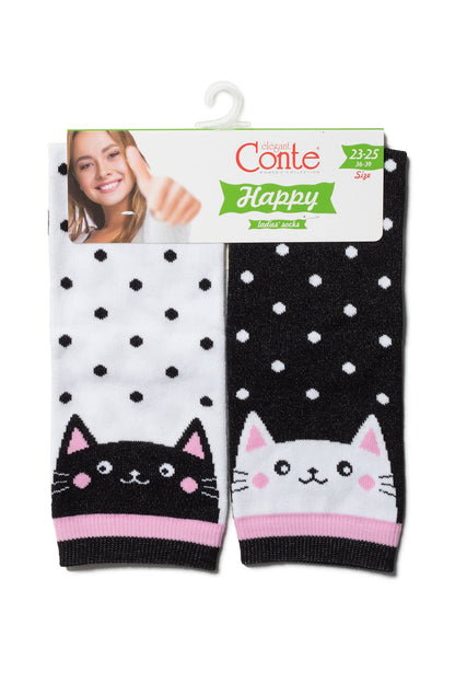 A pair of women's socks featuring polka dots and cat faces, with one white sock showing a black cat and one black sock showing a white cat, hanging from a branded display header.