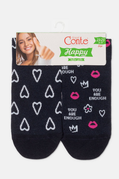 A pair of dark navy women's ankle socks featuring a white heart pattern on the left sock and pink lips, crowns, flowers, and the text YOU ARE ENOUGH on the right sock, displayed on a branded retail header card.