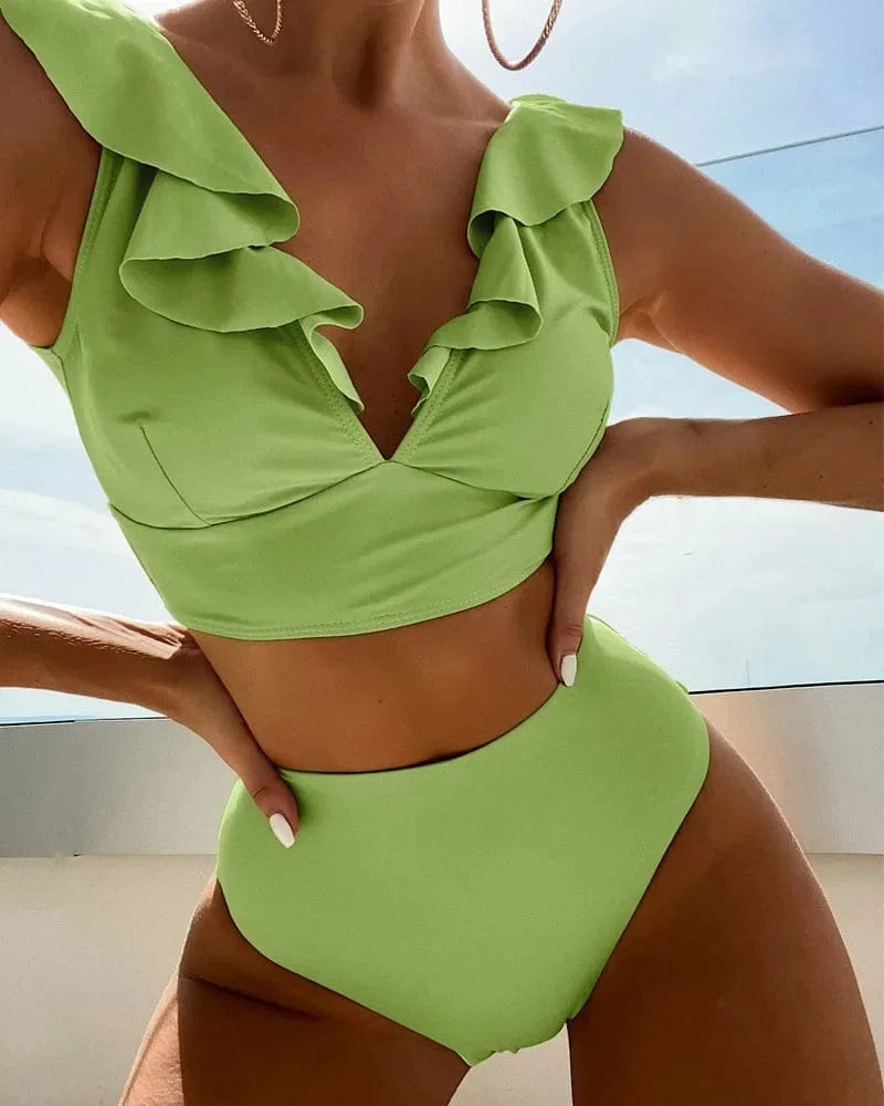 A light green high-waisted bikini set featuring a ruffled v-neck crop top and matching high-cut bottoms.
