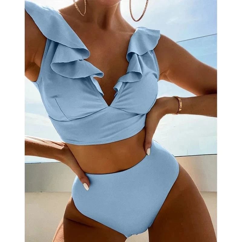A light blue two-piece bikini featuring a high-waisted bottom and a cropped top with a deep V-neckline framed by ruffled shoulder straps.