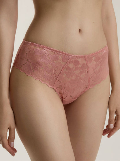 Dusty pink lace hipster panties worn by a model against a plain light background.