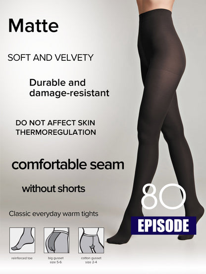 A pair of opaque matte black tights shown on a model's legs with diagrams at the bottom illustrating features like a reinforced toe, a large gusset, and a cotton gusset.