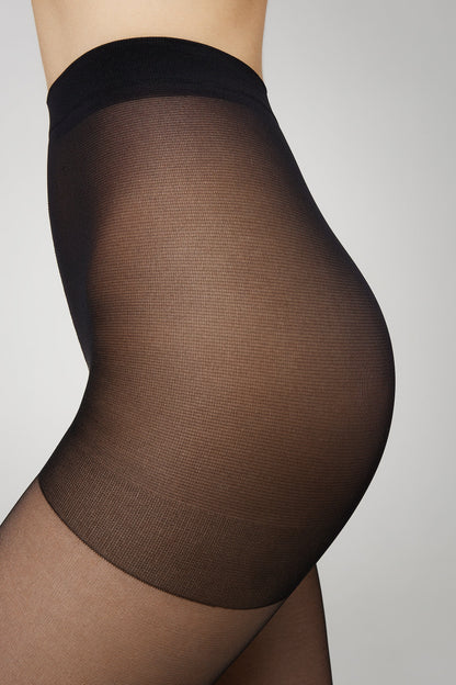 Black maternity tights featuring a sheer texture and a high-waisted design worn on a pregnant torso against a plain grey background.