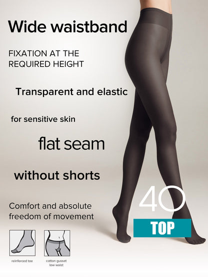 A pair of sheer black tights worn by a model against a plain background, featuring a wide waistband, flat seams, a reinforced toe, and a cotton gusset.