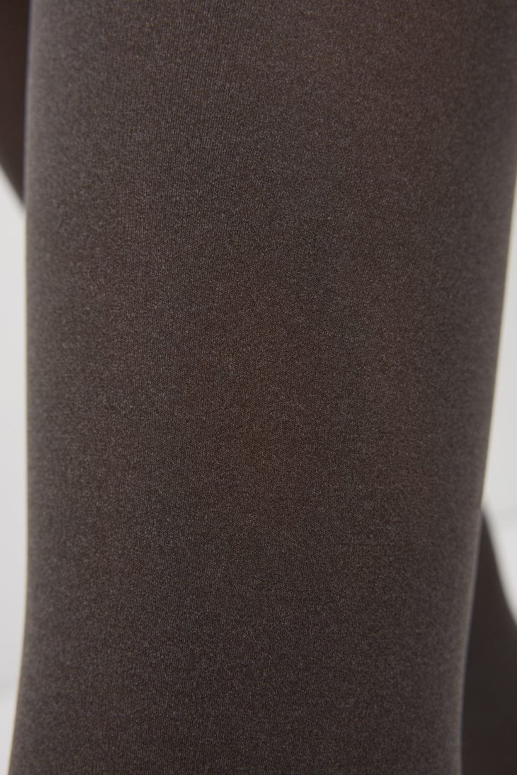 A close-up view of smooth, dark brown fabric with a fine, uniform knit texture.