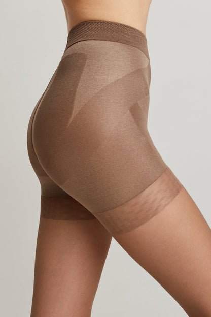 High-waisted brown shapewear shorts with a seamless design and sheer paneling at the bottom hem, shown on a person in profile view against a light gray background.