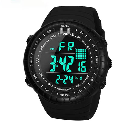 A black digital sports watch with a circular bezel marked with compass directions, featuring a glowing cyan digital display showing the time, date, and day of the week on a matching silicone strap.