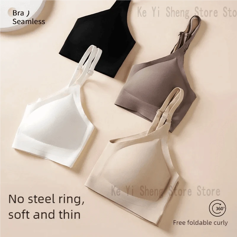 Four seamless wireless bras in black, white, mocha, and beige are arranged on a plain light background.