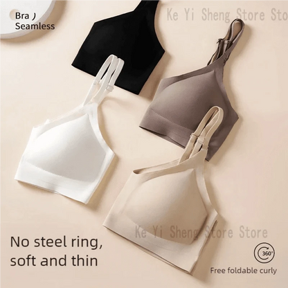 Four seamless wireless bras in black, white, mocha, and beige are arranged on a plain light background.