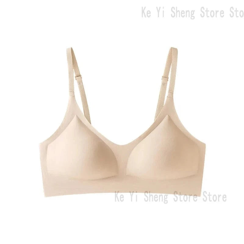 A beige wireless bra with molded cups and thin, adjustable shoulder straps against a white background.