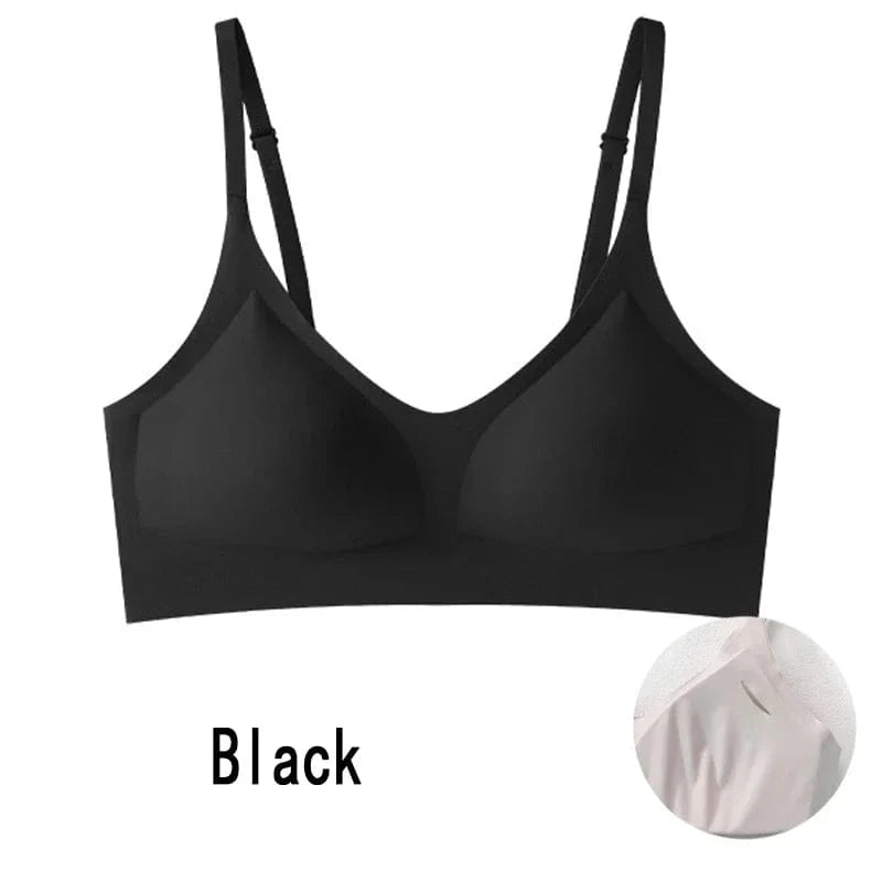 A black seamless bralette with adjustable spaghetti straps and padded cups, displayed alongside a small circular inset showing a close-up of a neutral-colored fabric texture.