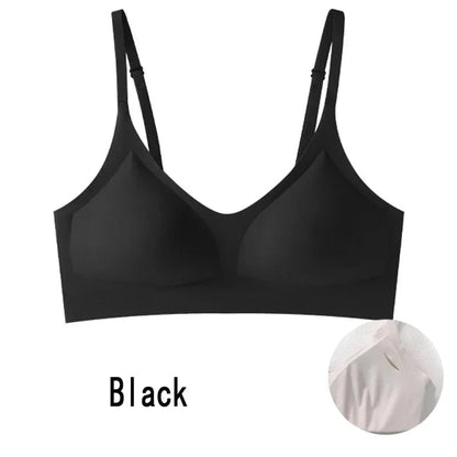 A black seamless bralette with adjustable spaghetti straps and padded cups, displayed alongside a small circular inset showing a close-up of a neutral-colored fabric texture.