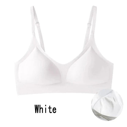 A white seamless wire-free bra with thin adjustable straps, featuring moulded cups and a clean, minimalist design.