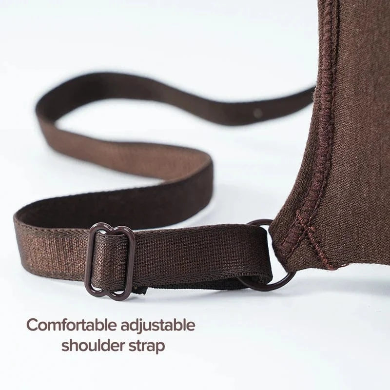 A close-up view of a brown adjustable shoulder strap attached to a matching fabric garment by a metal slider and ring.