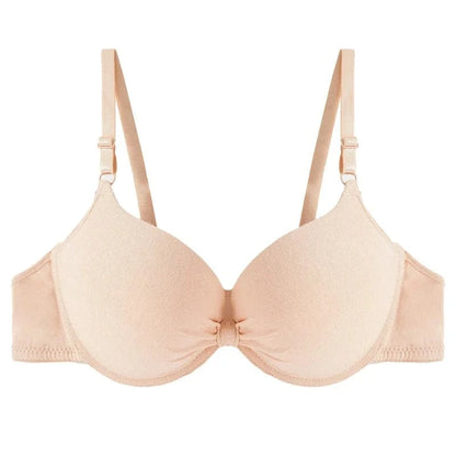 A beige underwire bra with molded cups and adjustable shoulder straps featuring a small gathered detail at the center bridge.