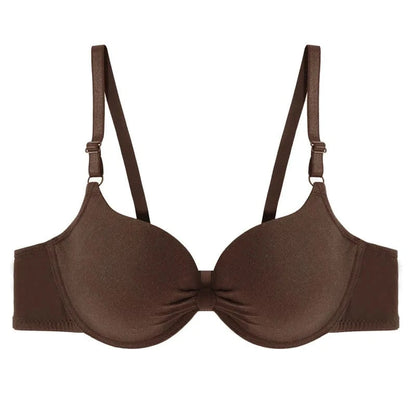 A brown push-up bra featuring molded cups with a central ruched detail, adjustable shoulder straps, and a simple hook-and-eye back closure.