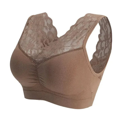 A beige wireless bra featuring a deep V-neckline with delicate floral lace trim along the straps and upper chest panels.
